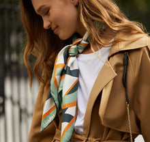 Load image into Gallery viewer, Model wears Sustainably handcrafted Sésam modernist silk scarf around neck