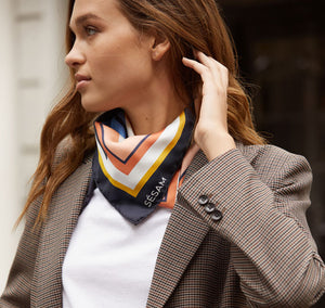 Model wears Sésam french porte italian silk twill scarf around neck